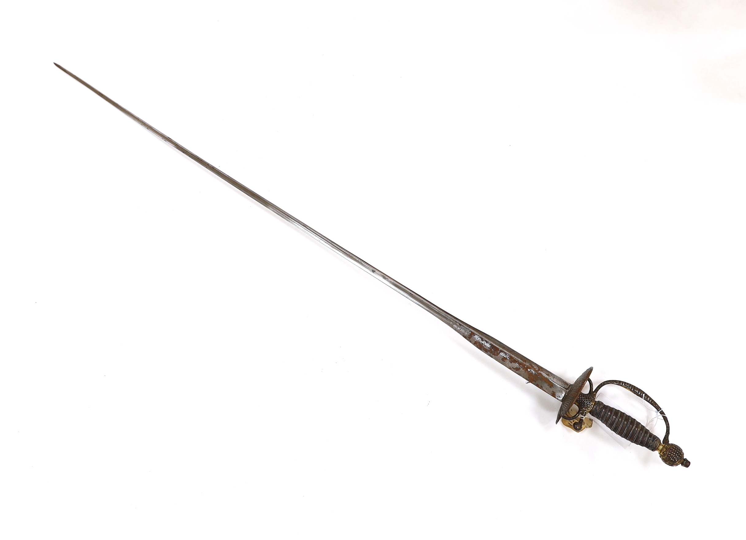 A French iron hilted small sword, hilt with flutes and tiny gold dots, the knuckle guard with key decoration, iron tape and silver wire bound grip, colichemarde blade with etched strapwork decoration, c.1770, blade 83cm